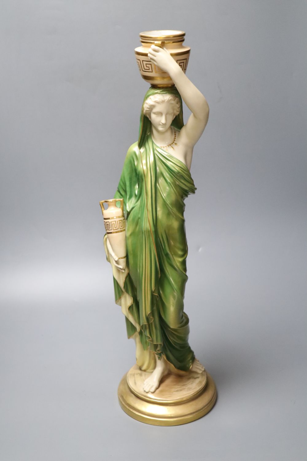 A large Royal Worcester figure of a female water carrier, early 20th century, 52cm